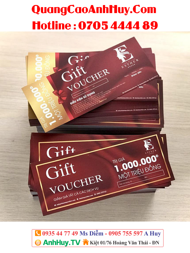 a stack of red and gold gift vouchers